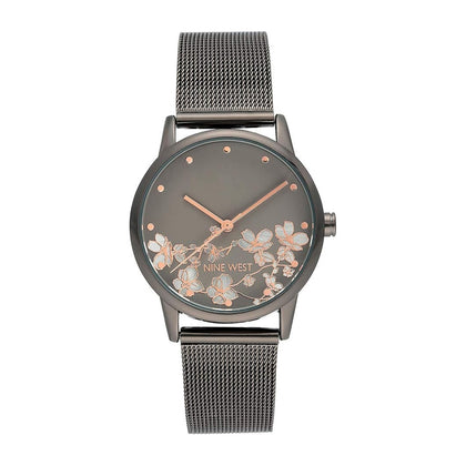 Reloj de pulsera para mujer Nine West con diseño floral, manecillas doradas, pulsera plateada, cristal resistente