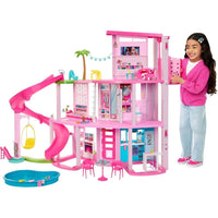 Casa de muñecas Barbie Dreamhouse con tobogán espiral, 75+ accesorios, ascensor para mascotas y zonas de juego